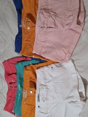 7 Pair. 4 Size 5, 3 Size 7. Colorful Mix of Women's Denim Shorts